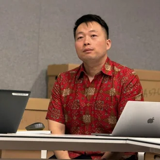 Song Fei at his desk